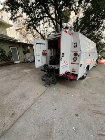 Magnet Plumbing service vehicle on-site for Grease Trap Cleaning in Wilshire Hills